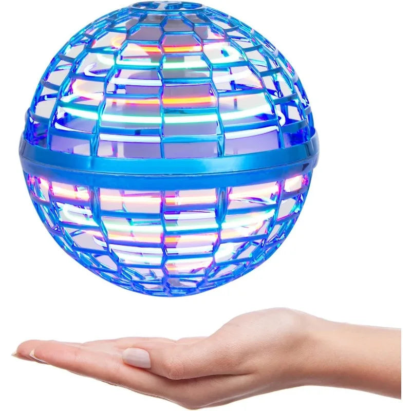Colorful disco ball held in a hand on a white background