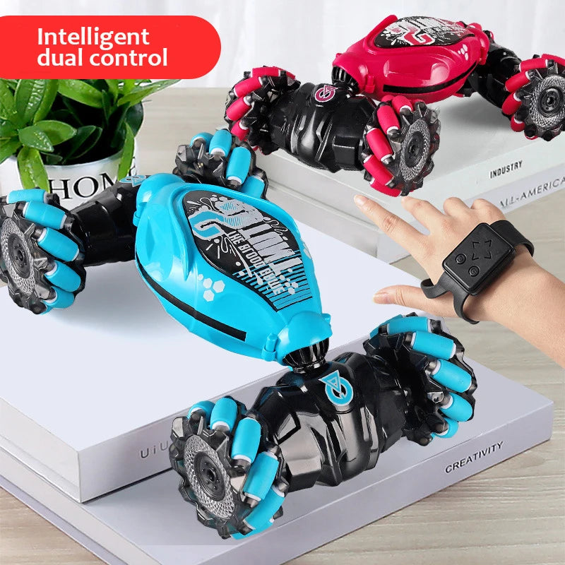 Toy robot with blue and black arms controlled by a wristwatch on a white surface.